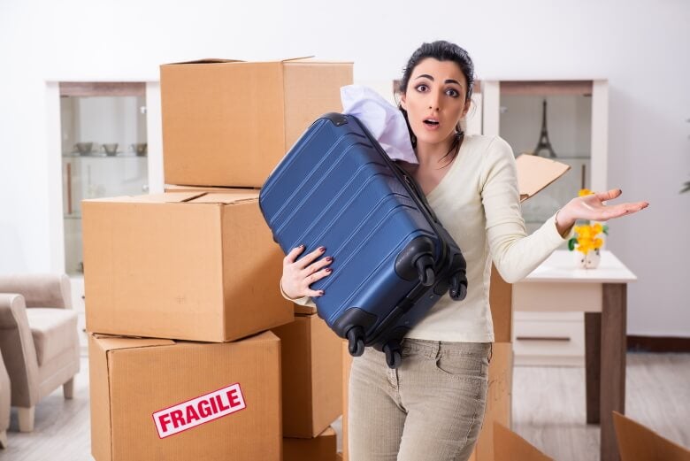 confused woman with a suitcase