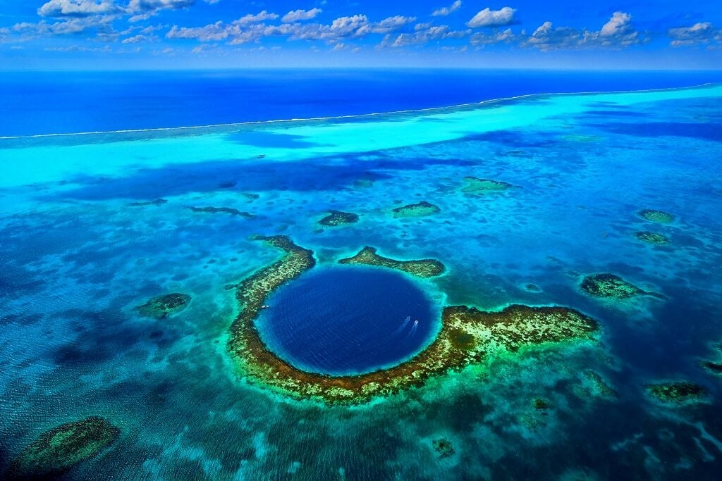 Aerial photograph of the Great Blue Hole in Belize's barrier reef.